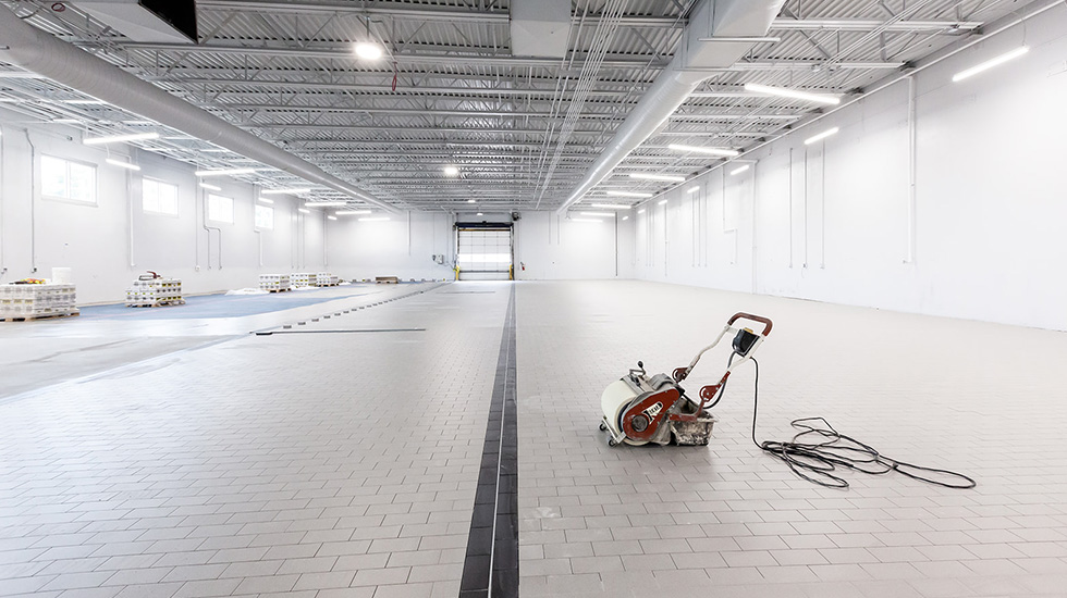 installation of flooring at auto dealership