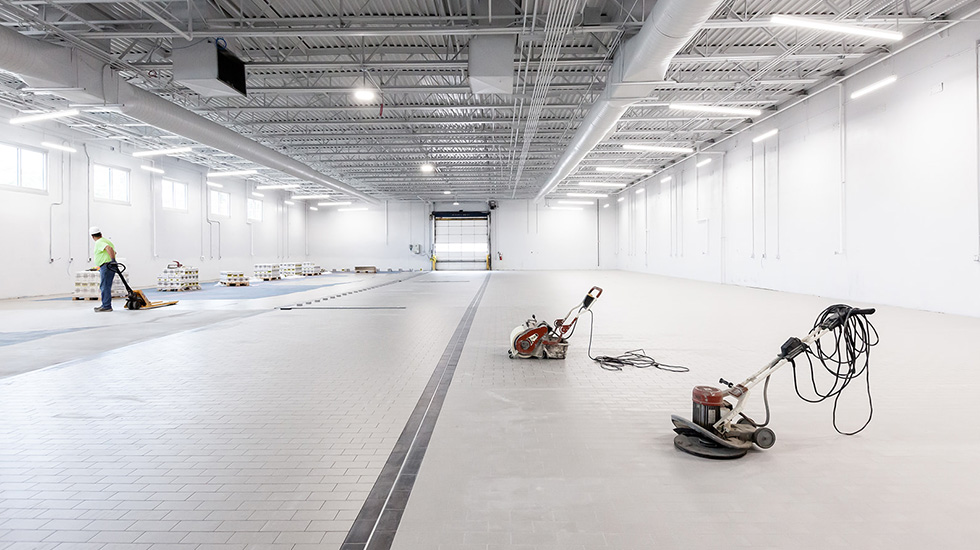 installation of flooring at auto dealership