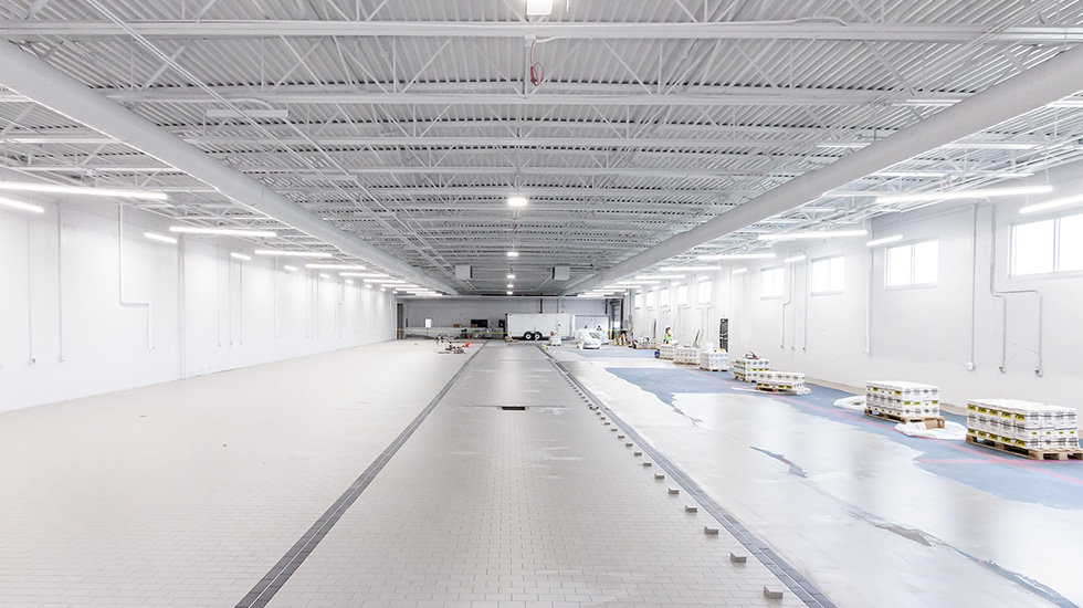 installation of flooring at auto dealership