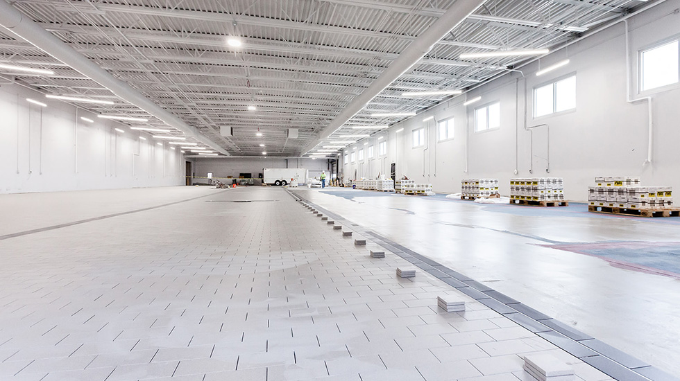installation of flooring at auto dealership